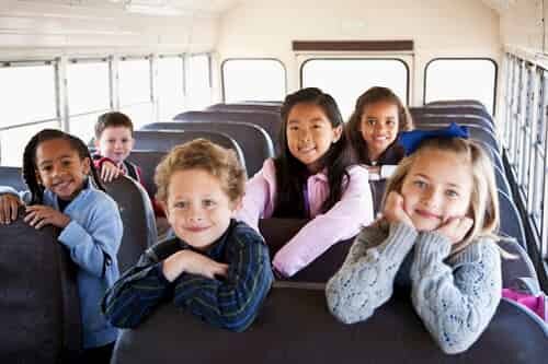 Happy kids on school bus